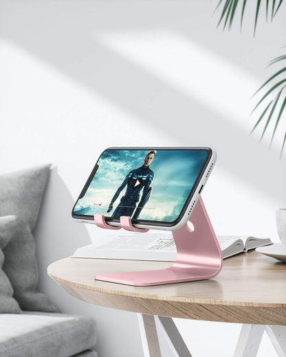 OMOTON Upgraded Aluminum Cell Phone Stand for Desk, C1 Durable Cellphone Dock with Protective Pads, Smart Stand Designed for iPhone17, 16/15/14/13 Pro Max Air, iPad mini, Android Phones,Rose Gold