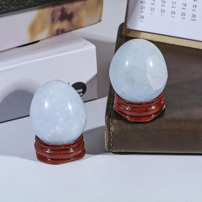 Rockcloud Natural Blue Celestite Crystal Egg Sphere with Wood Stand, Polished Stone Egg Figurine Ornament Decoration for Meditation, 30-39mm