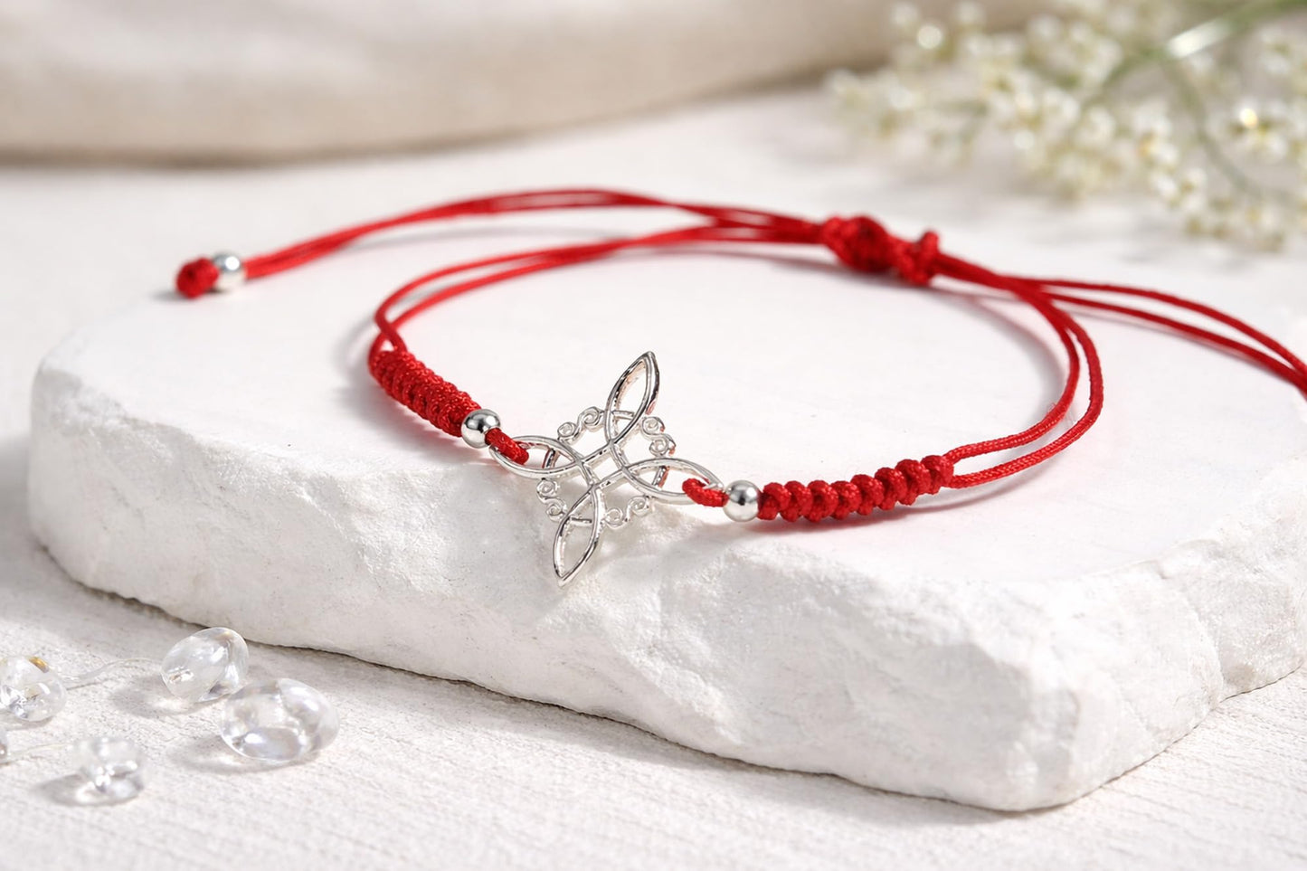 AeraVida Adjustable Red Witches Knot Bracelet with Sterling Silver Flower Charm – 19mm Symbol Centerpiece, Cotton Rope Band 6 to 9 Inches, Sliding Knot Closure