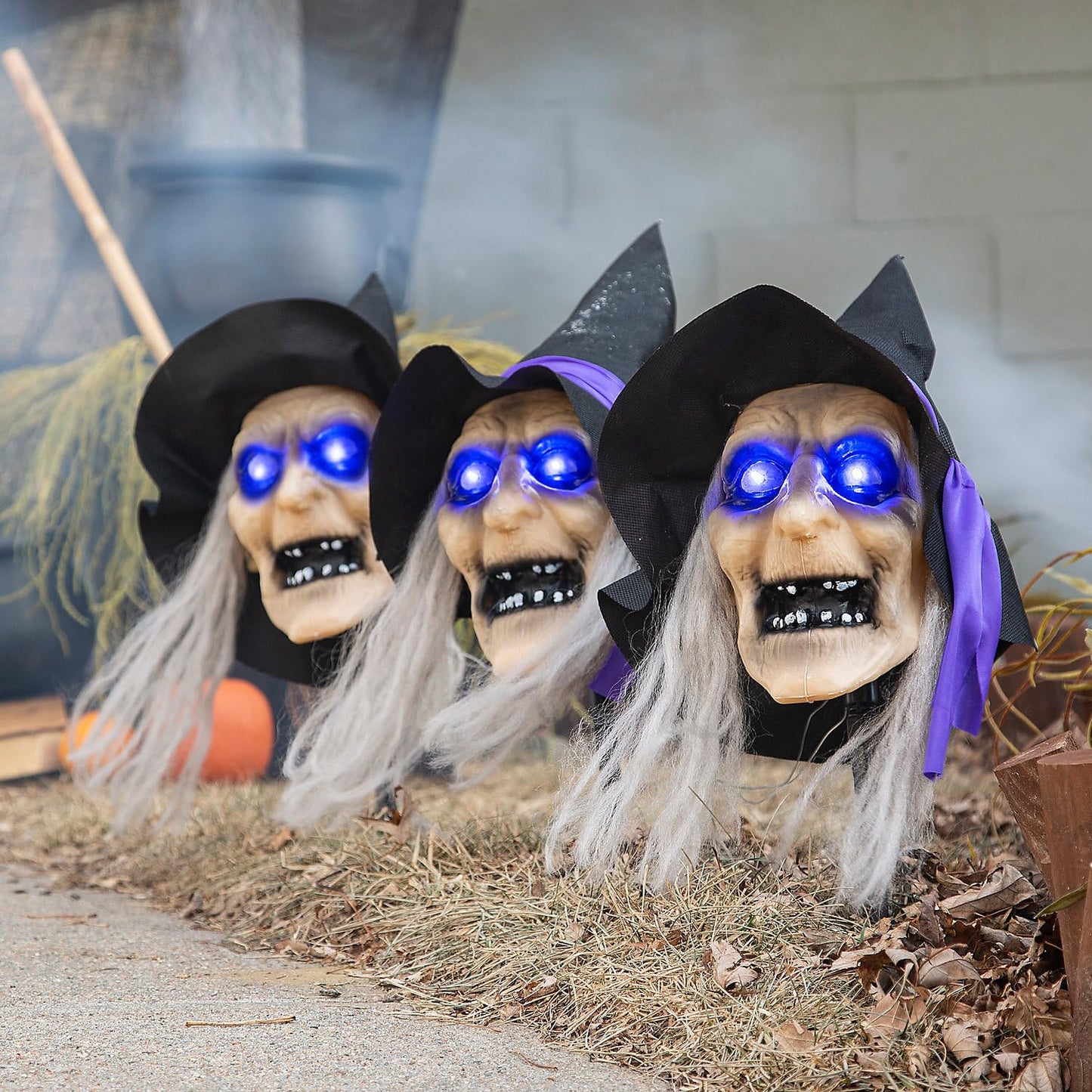 Fun Express 3 Pieces 2 ft. Light-Up Witch Head Yard Stake Halloween Decorations