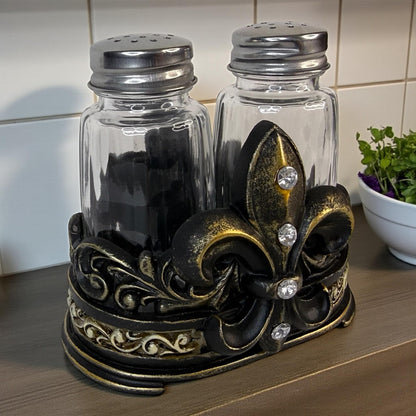 Fleur De Lis Salt and Pepper Shaker Set with Decorative Resin Holder – Glass Shakers with Stainless Steel Lids – French Country Cajun Kitchen Decor – 3 3/4” Tall Tabletop Seasoning Set