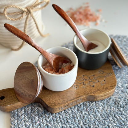 UhMAZING SALT AND PEPPER CELLAR SET WITH ACACIA WOOD LID AND ENGRAVED DECORATIVE HOLDING TRAY - WHITE AND BLACK